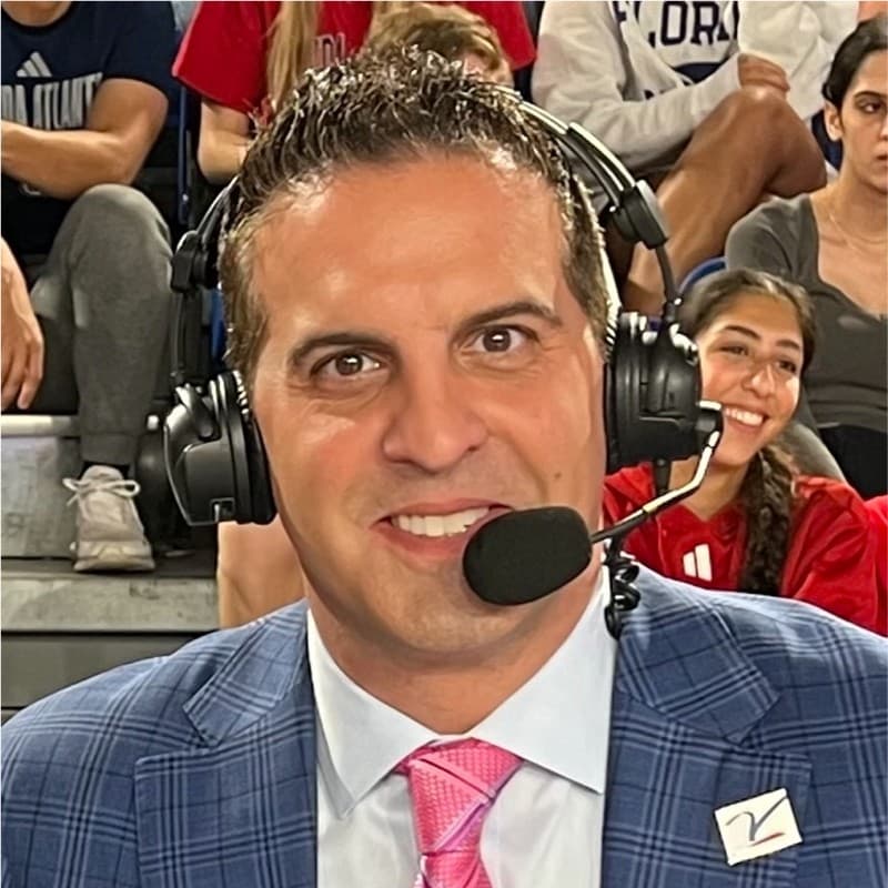 Mike Corey on a headset during a broadcast